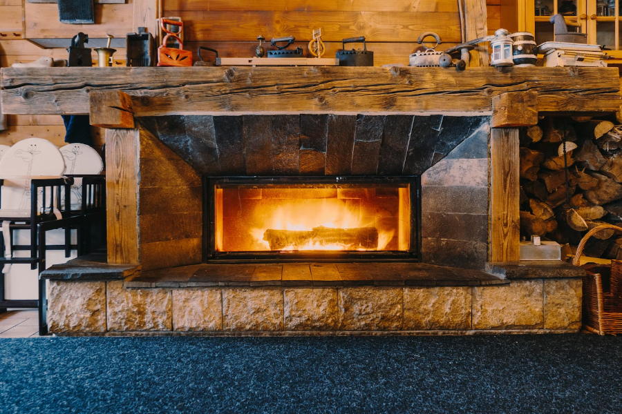 Chimney cleaning log burning in a fireplace in CT