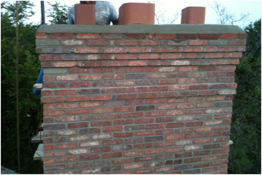 Brick chimney repairs underway. 