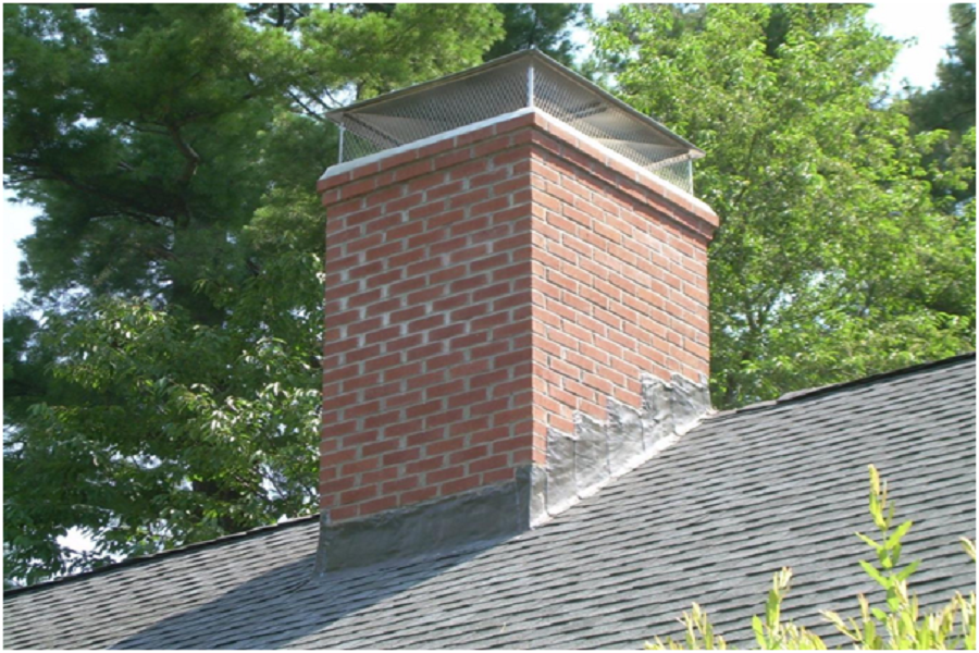 Brick chimney with a mesh cap. 