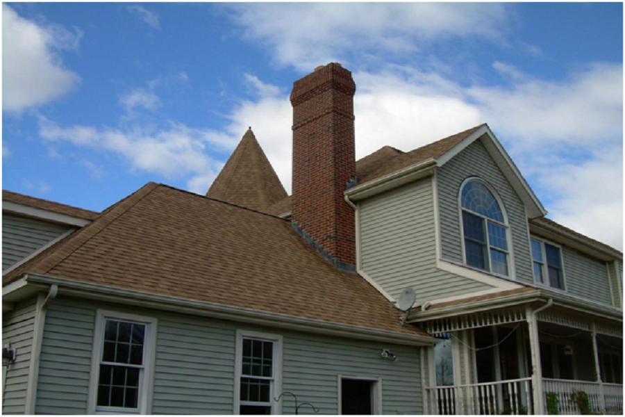 Brick chimney in a traditionally themed house.